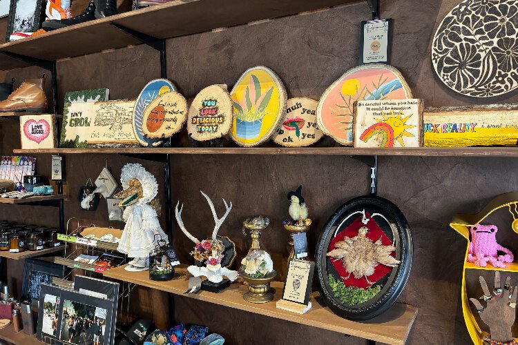 Chelsea Glade's wood-burning art and other unique creations line the walls at Orange Blossom Trading Co. 