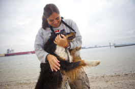 Veronica Simonetto owner of Tailored Pet Sitting hugs Maximillian. - Julie Branaman