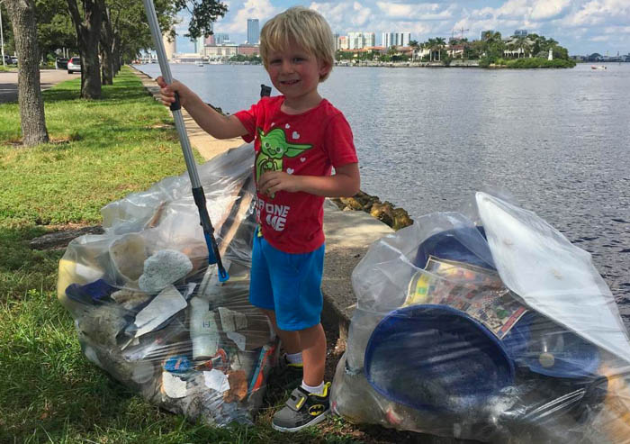 Cleanup is a family affair. Here, the youngest Mueller, Luke, does his part.
