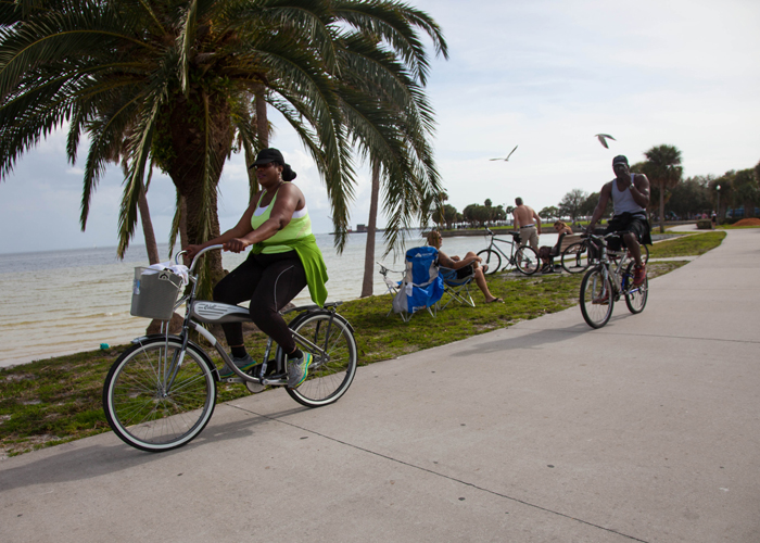 Cyclists along the waterfront in downtown St. Pete.