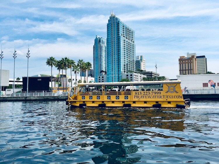 A water taxi traverses the Hillsborough River in downtown Tampa.