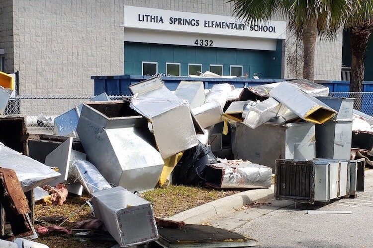Construction debris piles up outside Lithia Springs Elementary in Valrico in East Hillsborough County.