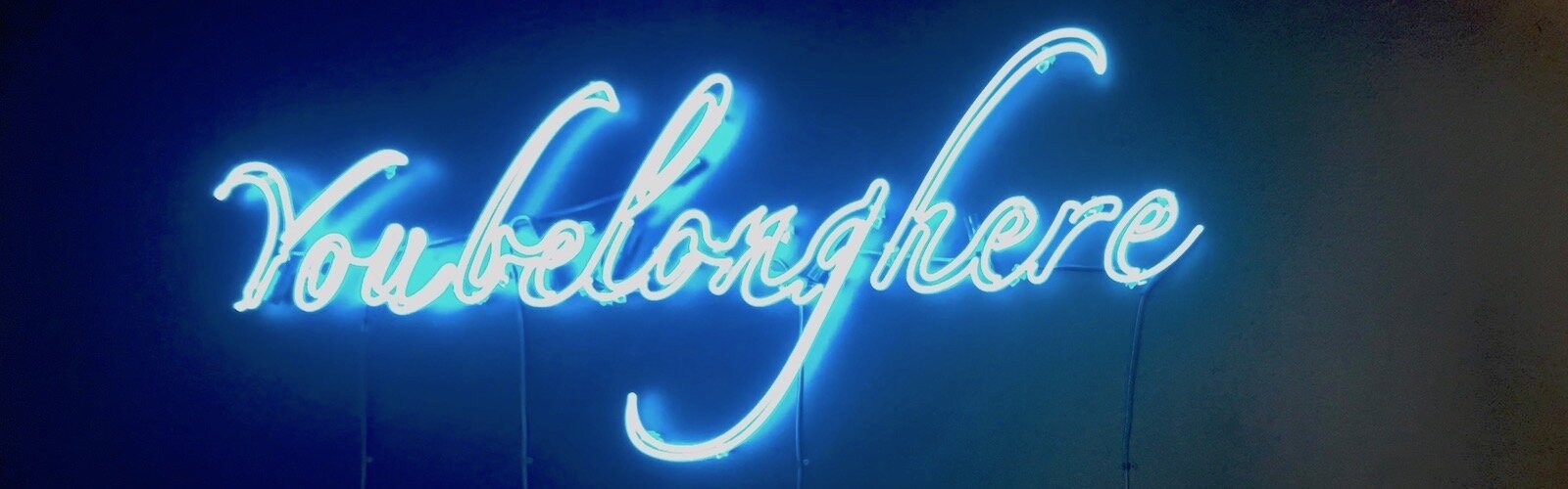 You Belong Here neon light artwork on display at Scarfone/Hartley Gallery in Tampa.