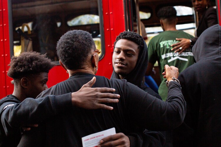 Two young men on the south side of St. Pete spontaneously join the tour, to learn about African American history, hugging and thanking Gwendolyn Reese as they depart. 