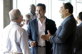 Sid Khurrum Hassan, founder of CUPS, chats with Mayor Buckhorn at an event at BoConcept. 