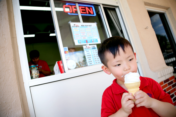 Tommy Lee, 3, enjoys a vanilla cone at Mr. Penguin on Platt St. 