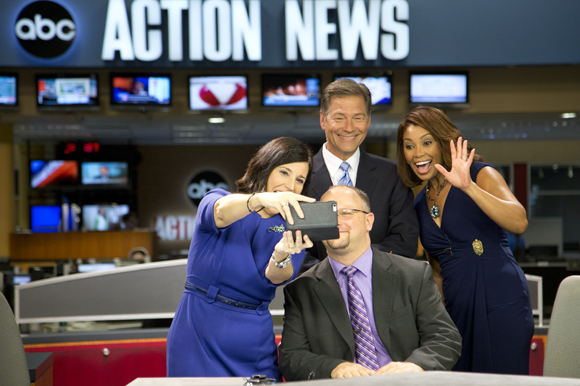 Lissette Campos, news anchors Dan Shaffer and Deiah Riley, take a selfie with Positively Tampa Bay guest Scott Richman.