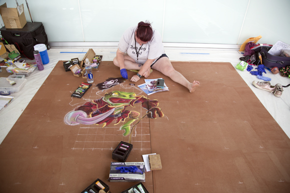 Artist Bridget Lyons works on a chalk design at Gasparilla Festival of the Arts.  