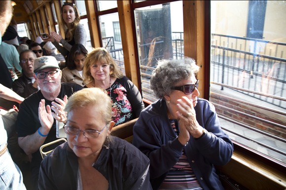 Tampa Streetcar riders clap for the Ries Brothers. 