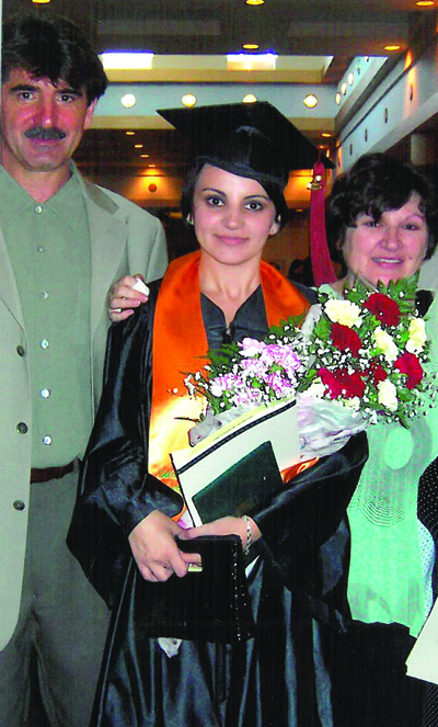 Karolak and her parents celebrate as she graduates from the University of South Florida St. Petersburg in 2005.
