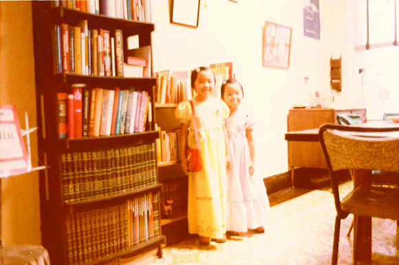 Phuong and her older sister on the day of their father's 1978 graduation from Penn State University.