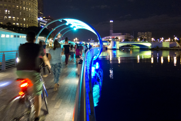 Tampa Riverwalk comes alive after dark with Lights on Tampa, festivals, and other activities.