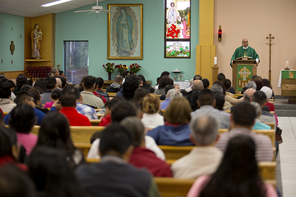 Father Gilberto Quintero leads Sunday Mass at Our Lady of Guadalupe in Wimauma. 