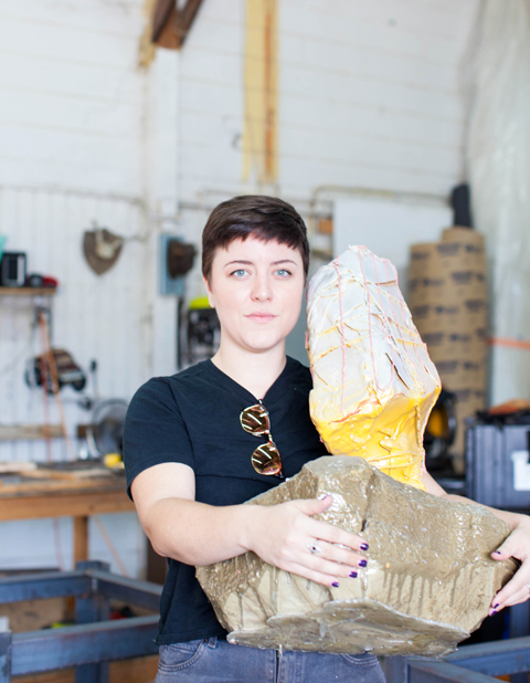 Jenn Ryann Miller, a mixed media painter and sculptor, at her shared studio space.
