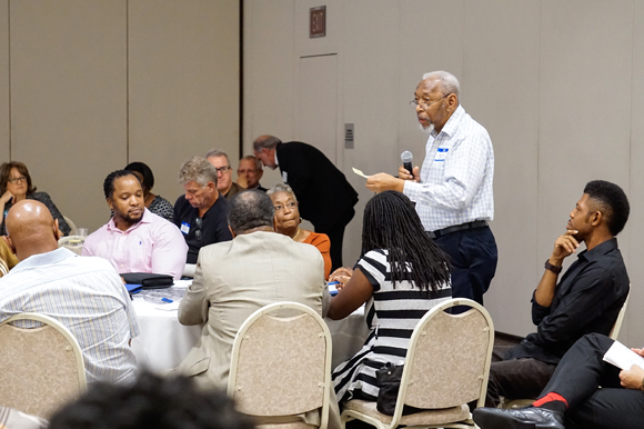 Ralph Scott, a West Tampa resident, presents his group's ideas during the meeting.