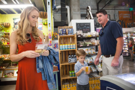 Lauren, Hudson, and Bryan Durkin pick up a popsicle at Duckweed Urban Market in downtown Tampa.