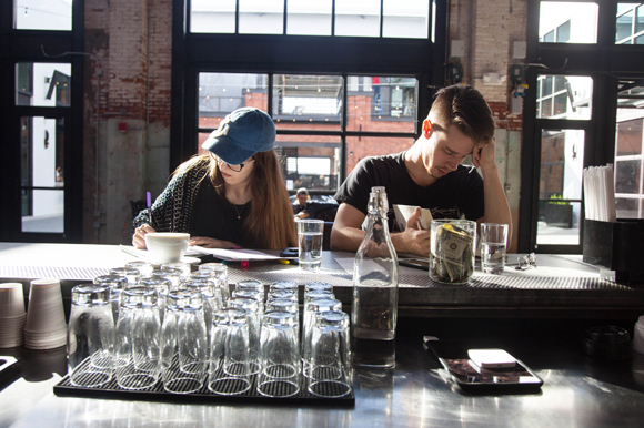 A duo studies and reads at Union Coffee and Tea in Armature Works.