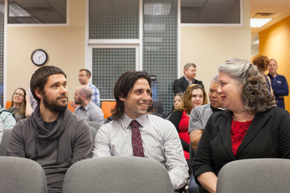 Michael Mattingly, left, Luis Orozco, and Giulia mingle at Launchcode's Tech Industry Networking Event.