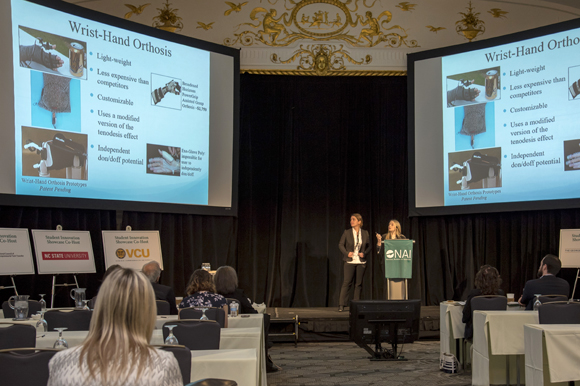 (L-R) Kalyn Kearney and Amber Gatto give a presentation on Powered Wrist-Hand Orthosis for Individuals with Spinal Cord Injury.