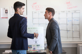 (L-R) Hayden Stokes of Tradebank of Tampa Bay talks with Djimo Serodio of Just Grow at the 2018 New Venture Expo at the University of Tampa. 