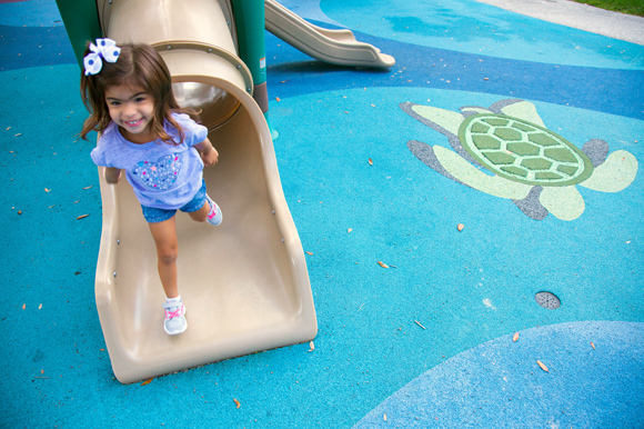 Maite Castillo, 3, plays at Macfarlane Park in West Tampa, named for Hugh Macfarlane who donated 40 acres for the creation of the park in 1908. 