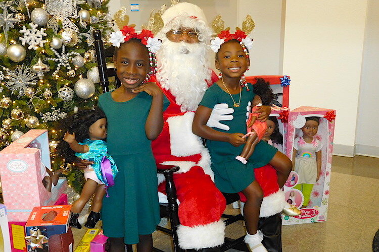 Santa and his elves at the Woodson holiday open house.