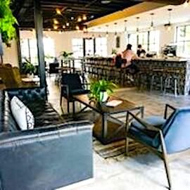 Visitors to Ybor Beverage Co. can settle into a comfy sofa, lounge chairs, or barstools.