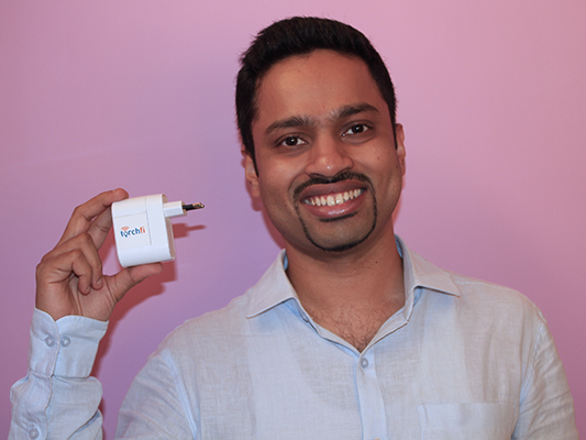Anup Balagopal, Torchfi Founder and CEO, with the Torchfi device