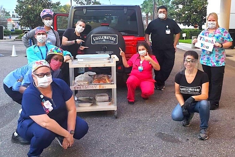 Gigglewaters staff delivers hot meals to first responders at John Hopkin's All Childrens Hospital in St. Pete.