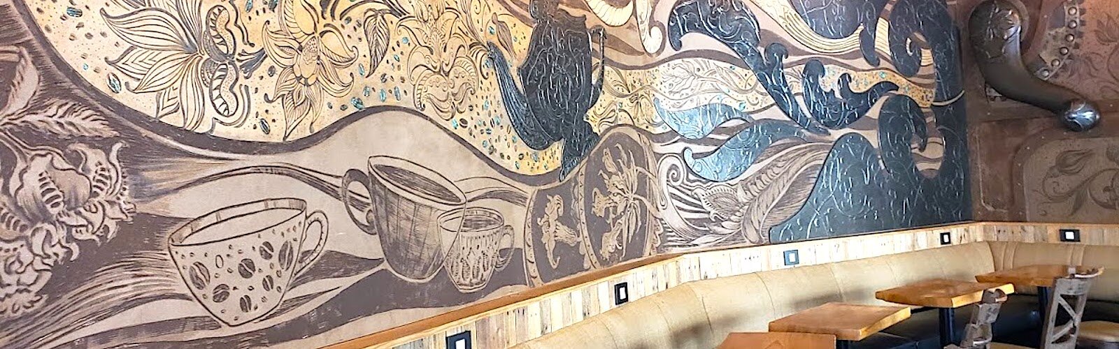 Funky murals on the walls of Grindhouse set the atmosphere for sipping coffee and sharing stories.