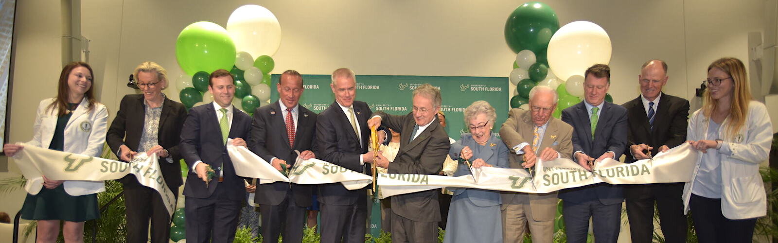 Dignitaries led by philanthropists Carol and Frank Morsani, USF Health VP Charles Lockwood, and Tampa Mayor Jane Castor cut the ribbon to the new USF Med School.