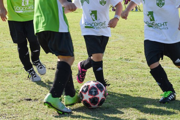 Play it Forward assists with soccer equipment and fees so every child, regardless of family income, can play.