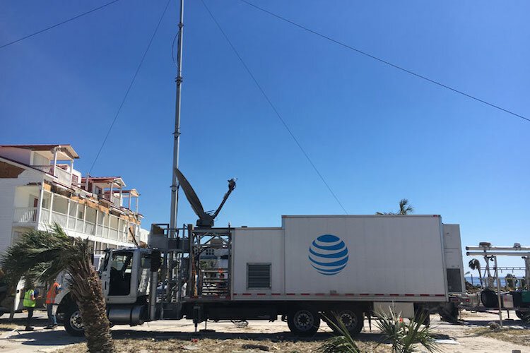 AT&T repair trucks move in asap following hurricanes in Florida to repair damage.