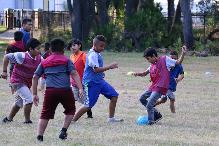 Organized leagues as well as pickup games of soccer and other sports help build a sense of community.