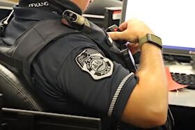 A Tampa police officer demonstrates use of the new body cams.