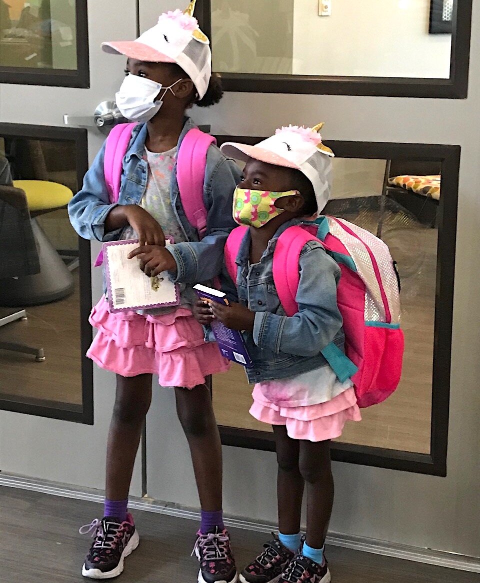 A backpack giveaway at ENCORP! ensured children living in public housing were ready for the start of school.
