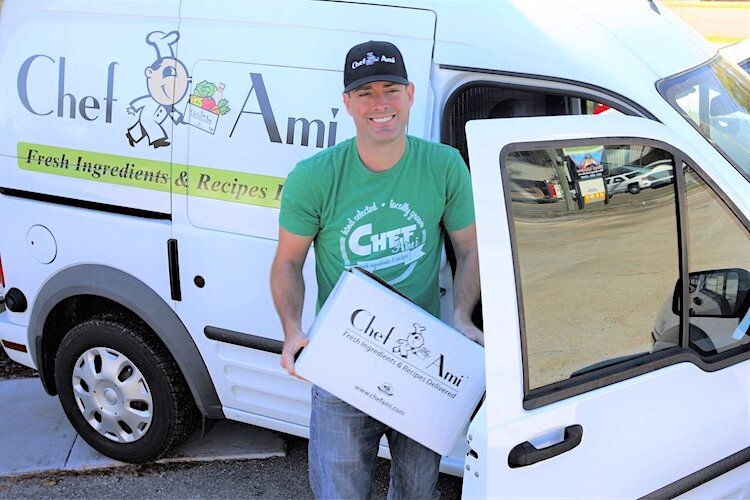Elijah Dickhaus hand-delivering Chef Ami meals in December 2019.