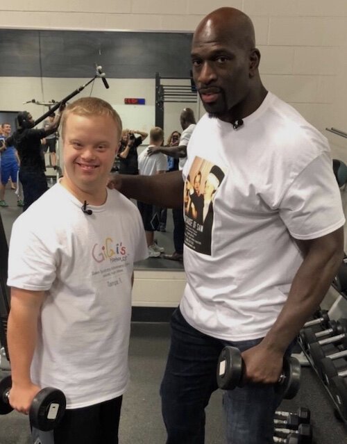 Sam Piazza meeting his hero WWE Superstar Titus O’Neil at the local YMCA.