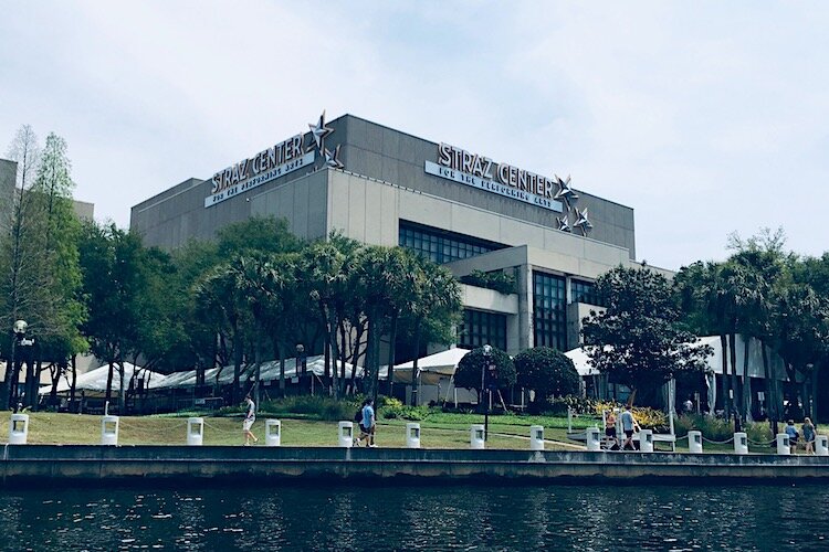 The Straz Center on The Tampa Riverwalk as seen from a passing boat.