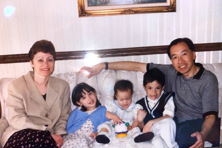 Lauren Wong as a toddler with her older siblings and parents.