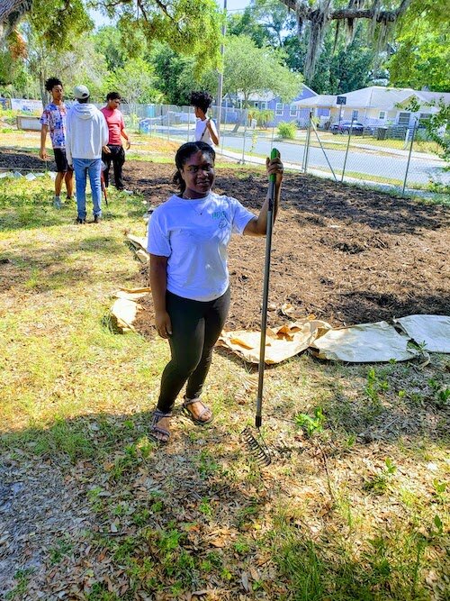 St. Pete Youth Farm youth ambassador Kazana Bennett, 19, says the farm provides a "calming, unifying experience.”