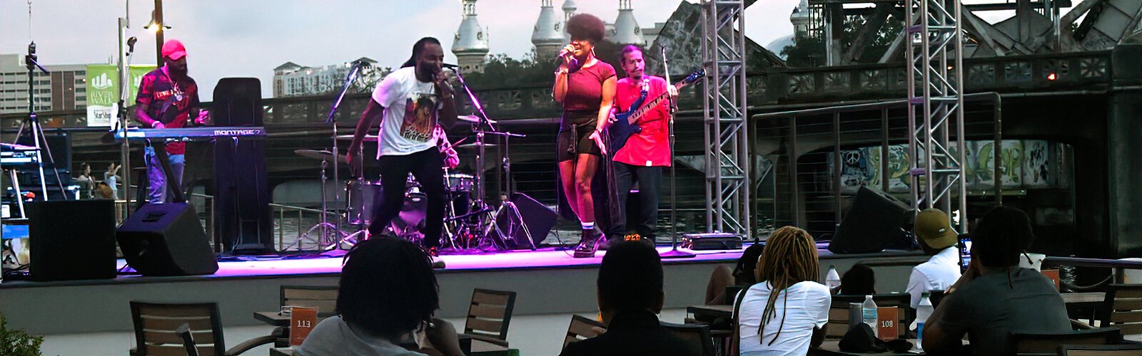 Singer artist and emcee/producer Jinx, a Tampa native, performs with his wife Shelby Sol and their band, on the Straz Center’s Riverwalk stage during a free outdoor concert for Fourth Friday.