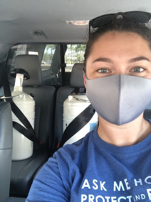 Florida Aquarium researcher Emily Williams drives cryo tanks with coral sperm to Miami.