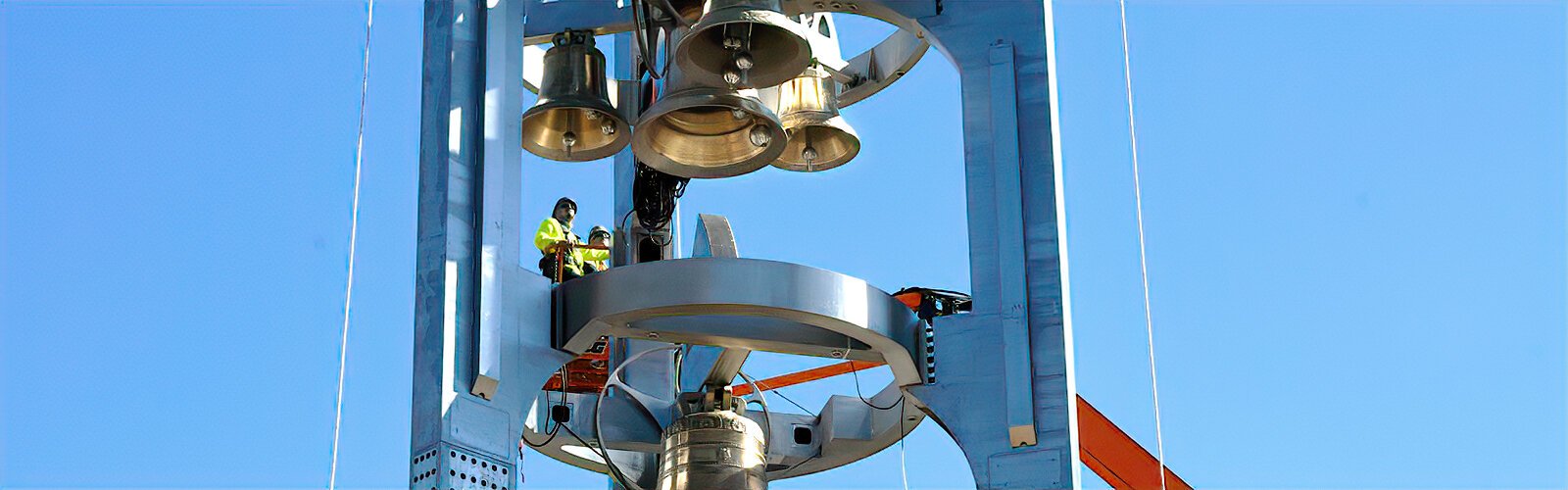 Workers from the Beck Group inspect the newly installed elements in the Ars Sonora. The musical sculpture has 4 specially designed swinging bells – 3 UT bells surrounding a medium fixed bell, and the largest of the 4, the Sykes bell, below.