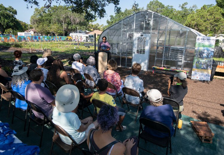 University of South Florida Associate Dean of Academic Affairs and Director of the Food Sustainability and Security concentration Joseph Dorsey addresses the crowd at the St. Pete Youth Farm greenhouse opening.