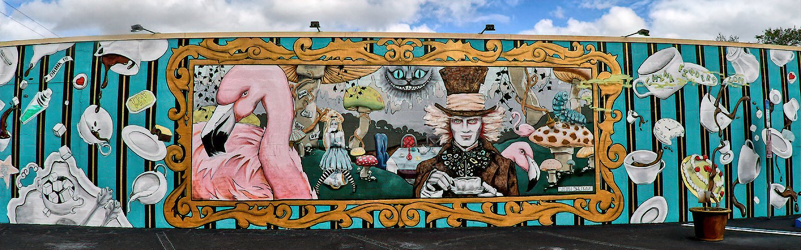 A very striking mural in the Grand Central District, the "Mad Hatter’s Tea Party" by Sarah Sheppard, was inspired by "Alice in Wonderland." It was commissioned especially by the dinnerware store China Finders and covers one side of their store.