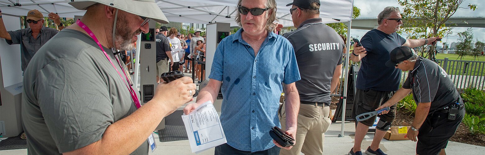 Frank Gaffney scans tickets for Cheap Trick at The Sound in Clearwater. The concert was free, but attendance was limited due to demand.