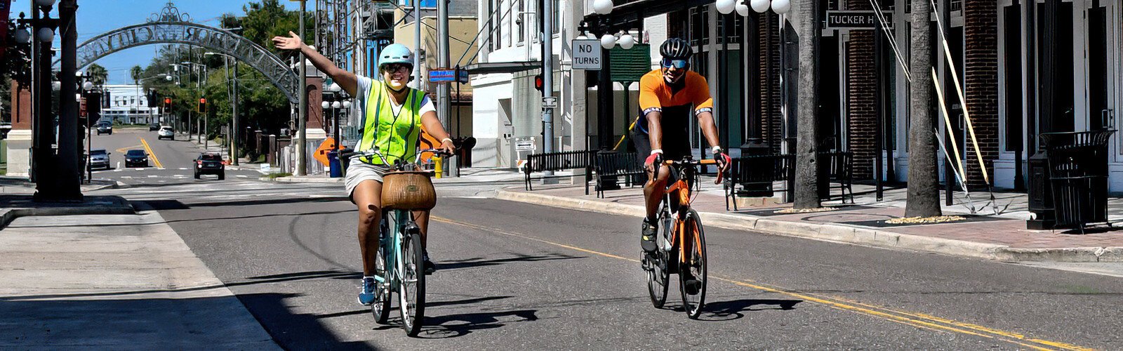 Two cyclists cheerfully ride along an empty Seventh Avenue in Ybor City as Tampa celebrates its first World Car-Free Day. The event takes place annually in some 2,000 cities in 46 countries.