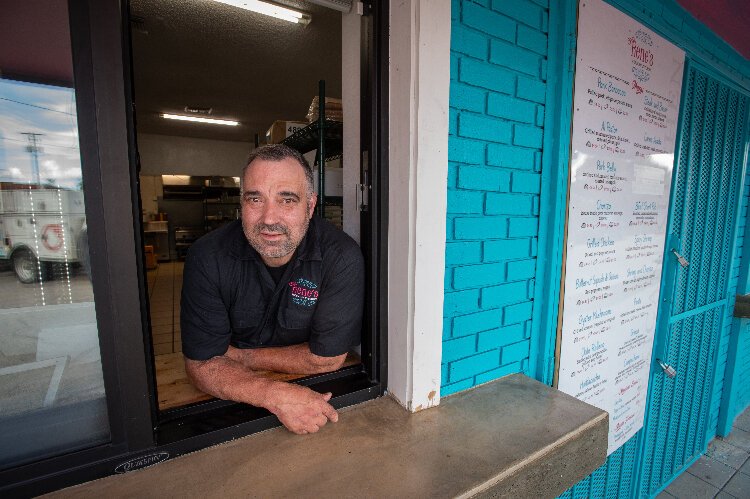 Rene Valenzuela in the service window at Rene's Mexican Kitchen's new Ybor City location.