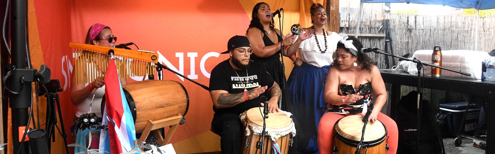 Performing in the courtyard, the Bomba Body Dance and Drumming Academy of Tampa Bay shares through their music an Afro Puerto Rican cultural experience with their audience.